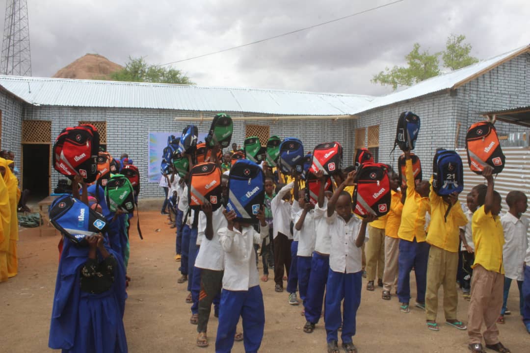 Distributing School Materials for Boys