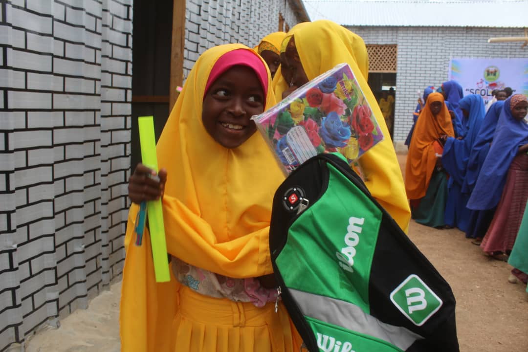Distributing School Materials for Girls
