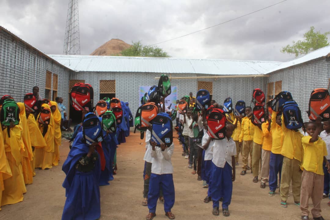 Distributing School Materials for Boys